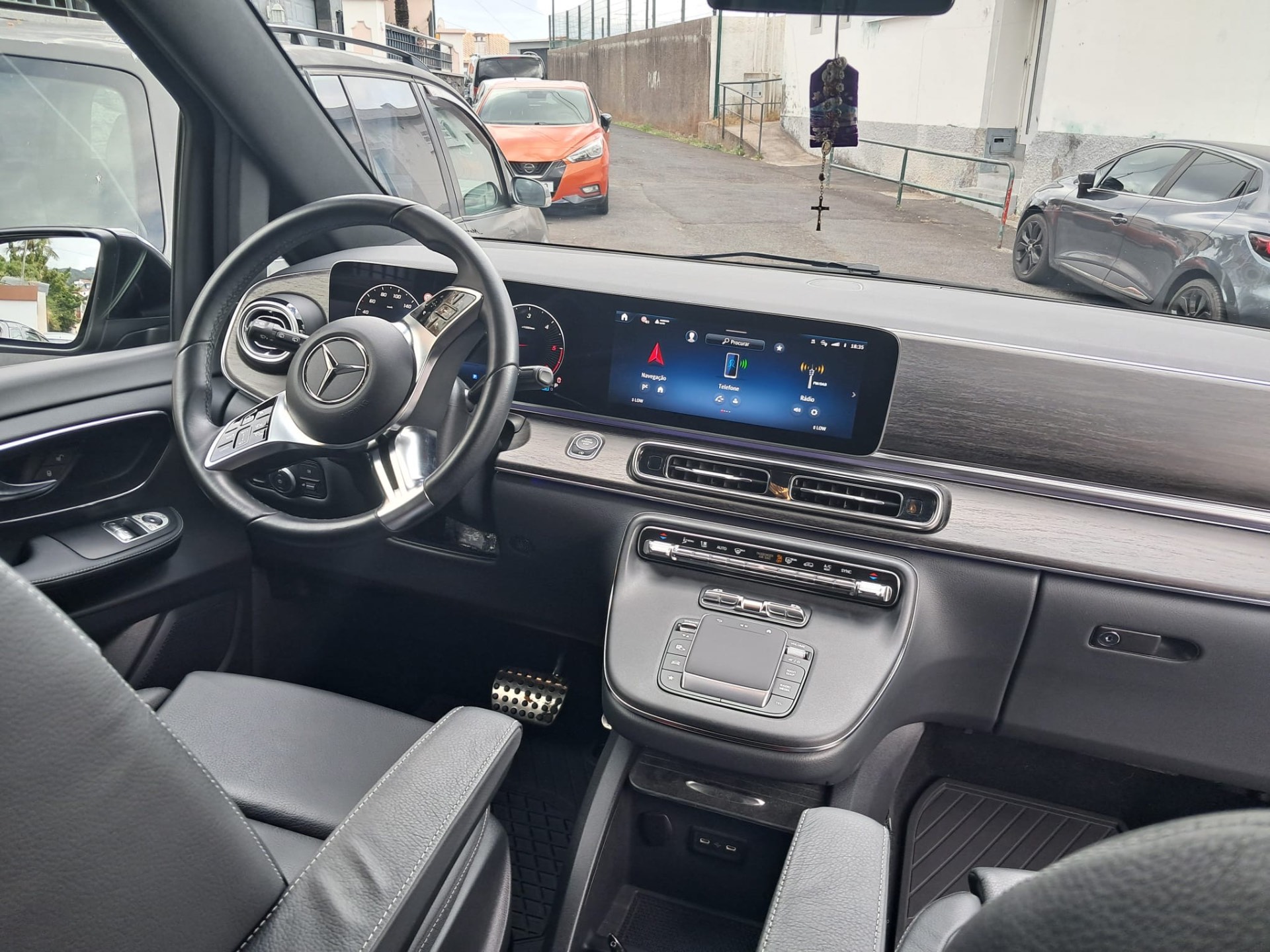 Mercedes EQV cockpit with the steering wheel and MBUX infotainment screen